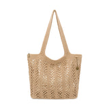 Tan crocheted tote bag with openwork pattern and long shoulder straps.