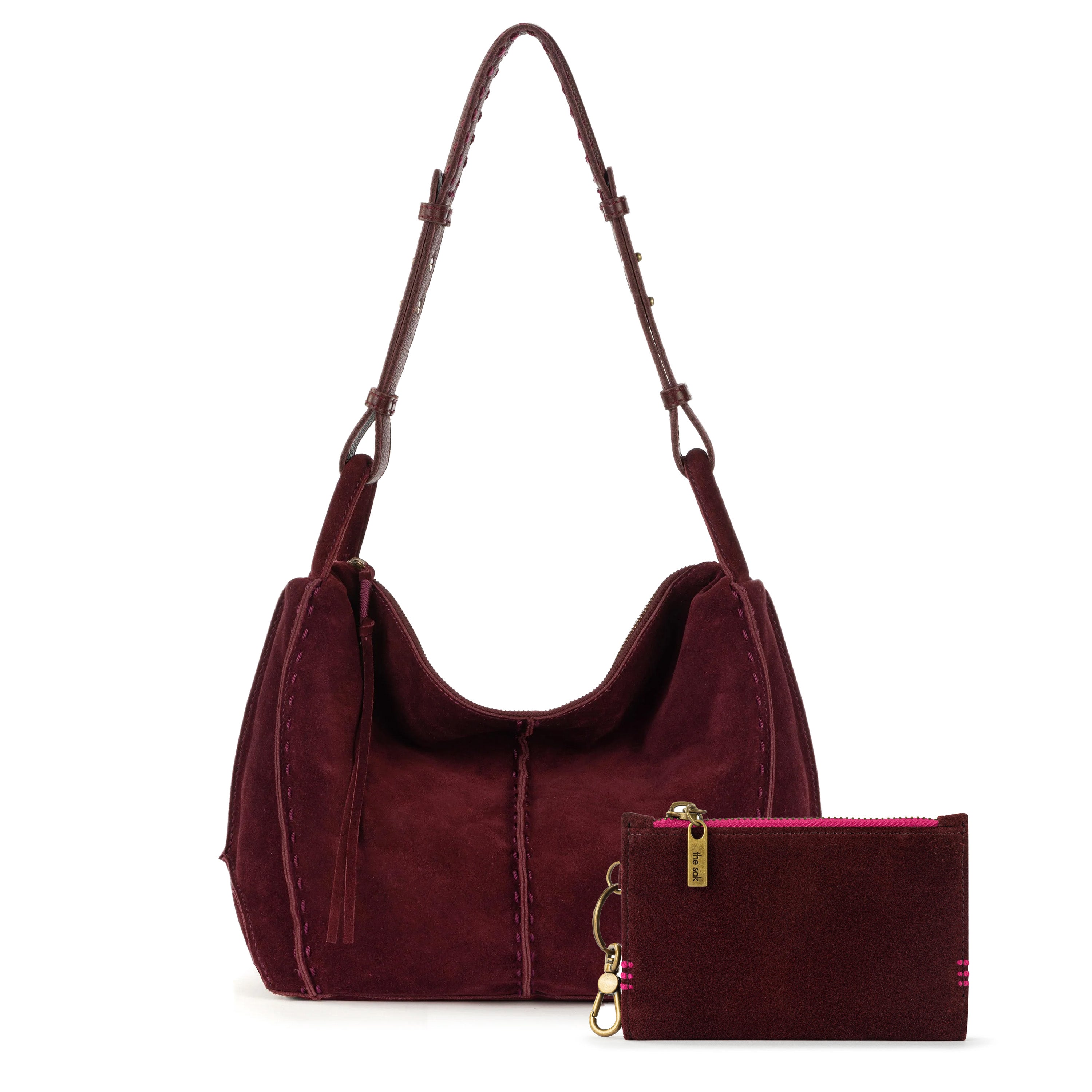 Burgundy suede hobo bag with long shoulder straps and matching small wallet with pink zipper and gold hardware.